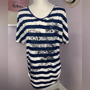 Medium short flowy sleeve blue and white shirt with ruching on the side.